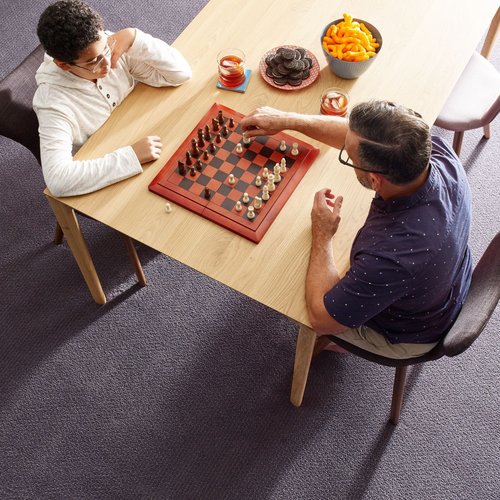 Two people playing chess - Main Street Carpets and Flooring in Texas City, TX