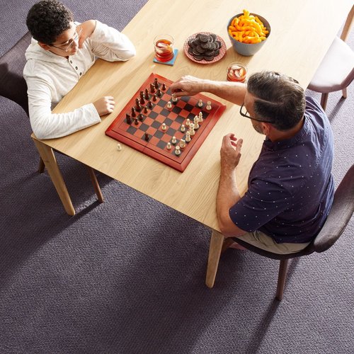 Two people playing chess - Main Street Carpets and Flooring in Texas City, TX