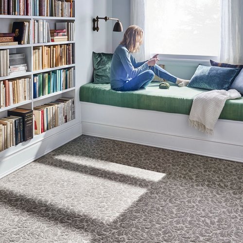 Girl reading on bed - Main Street Carpets and Flooring in Texas City, TX